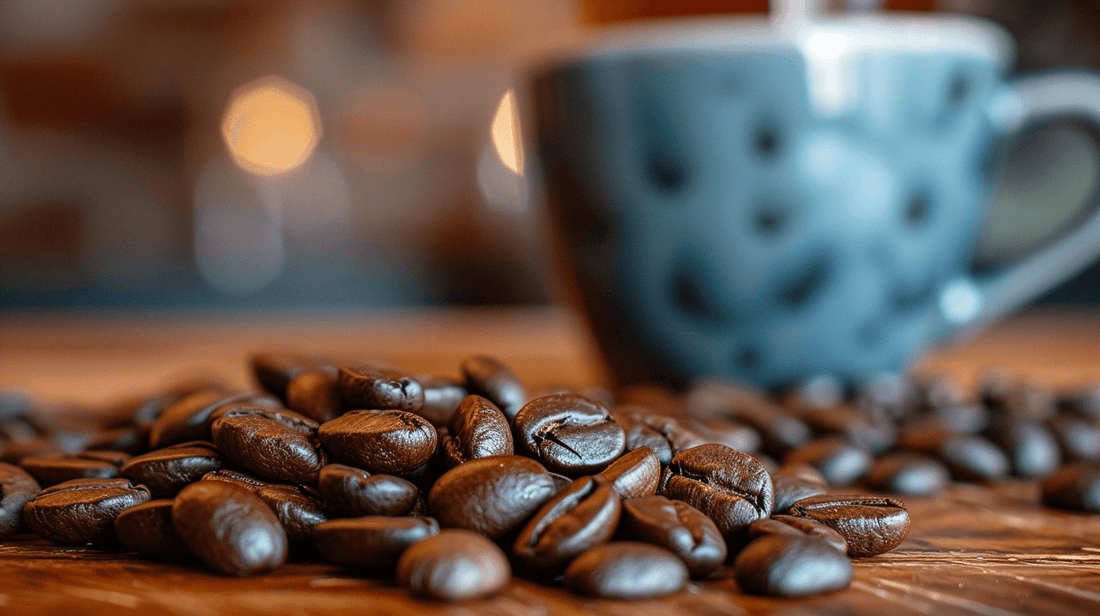 Close up shot of coffee beans with a coffee cup in the background
