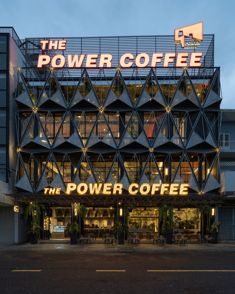Revolutionizing Café Design with Iron Pyramids and Greenery